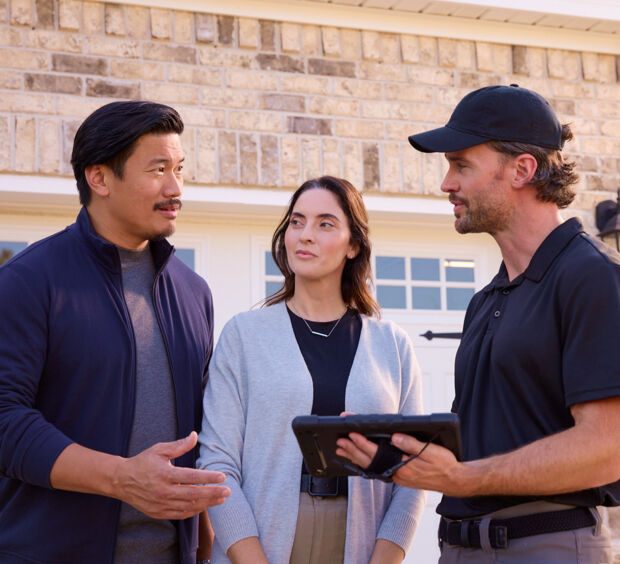 A local professional showing homeowners options on a tablet